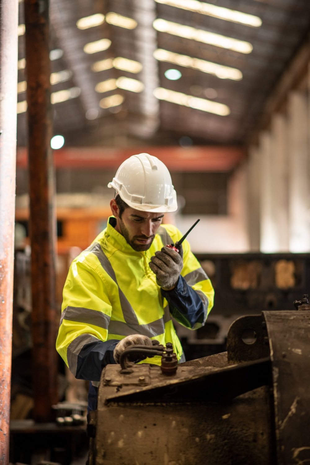 Mature man on construction site or business industry site.